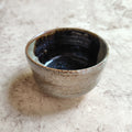 Oni-unofu-glazed indented tea bowl